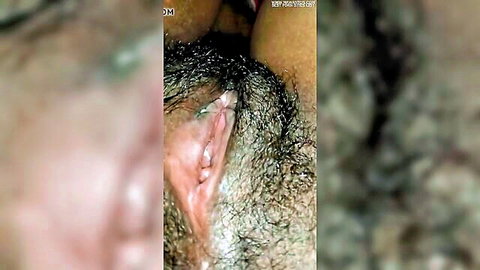 Close-up of Indian woman's hairy pussy entrance, explicit view