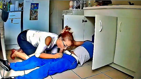 Redhead wife in glasses teases plumber by unzipping his pants