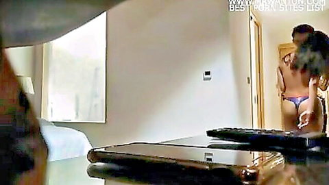 Asian beauty in purple thong surprised by lover's embrace in steamy room service