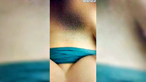 Hot woman in tight teal bikini bottoms with bushy pubic hair spilling out and pussy cameltoe visible