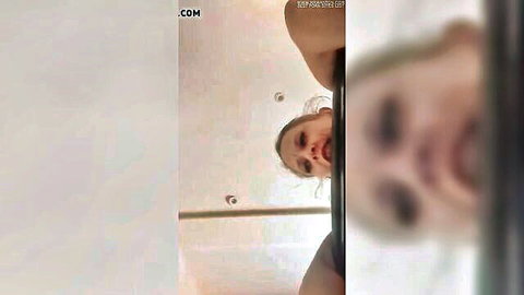 Pale skinny amateur girl's small tits exposed as she leans over upside down with intense open-mouthed expression