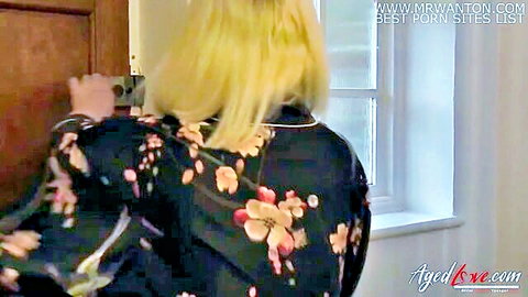 Blonde British mature in floral kimono teasing at door, interracial hardcore