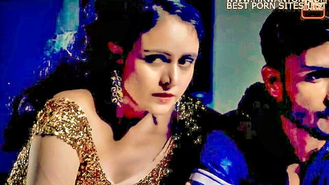 Desi couple in gold sequined top and blue jacket, intense gaze from hot Hindi web series