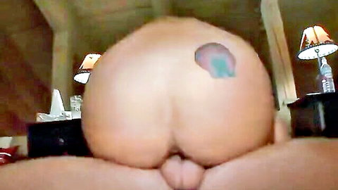 Closeup of skinny fair-skinned guy's small tattooed ass with exposed anus and dangling cock in cabin bedroom