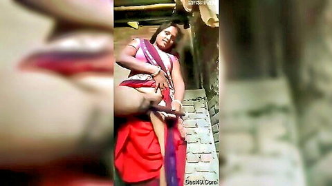 Bihari Indian woman in red sari exposing thigh in amateur outdoor tease