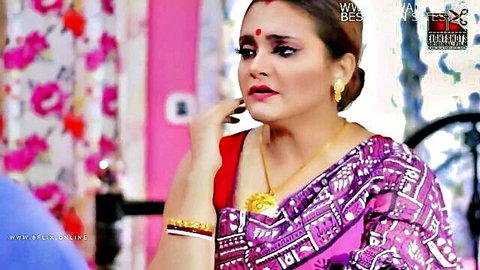 Seductive Indian bhabhi in purple saree touching lips