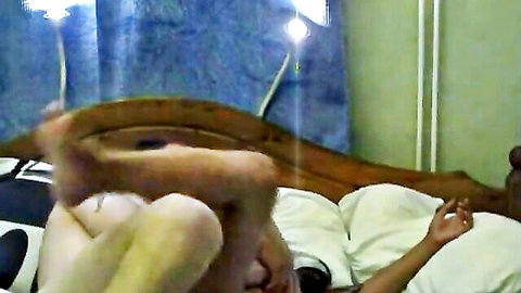 Deena Suarez solo legs up on bed, explicit pose