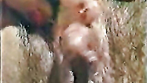 Close-up of woman's giant clitoris and wet hairy pussy in explicit solo view
