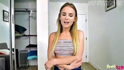 Young blonde brother's girlfriend in striped tank top and jeans