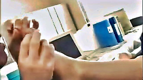Japanese office foot play with bare toes spread by hands