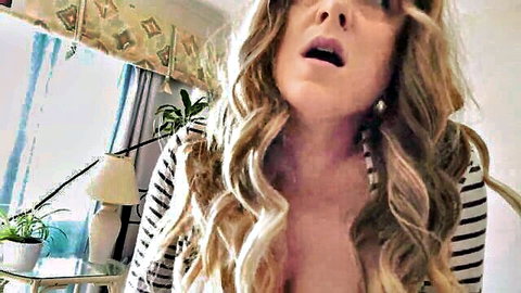 Blonde stepsister teases with open mouth and deep cleavage in striped top
