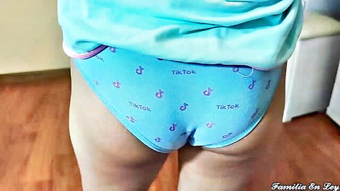 Petite teen bends over in pink TikTok panties showing juicy ass cheeks