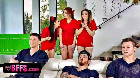 Three naughty teen cheerleaders tease lucky football fan during game behind friends' back
