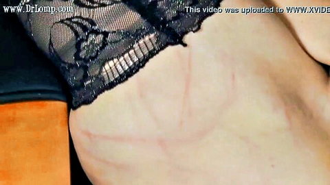 Blonde in black lace lingerie with BDSM whip marks on thigh in Dr Lomp dildo challenge
