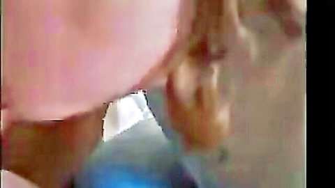 Blonde woman deepthroats thick cock with mouth stretched wide and bulging cheeks