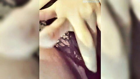 Close-up of wet pussy with hand and black lace lingerie