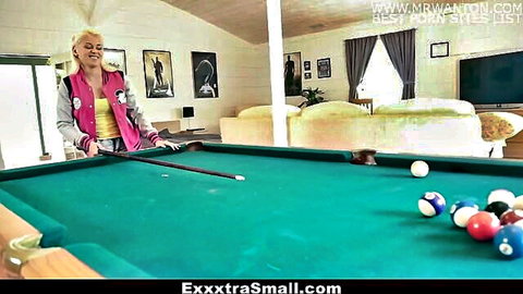 Marsha May blonde petite in varsity jacket bends over pool table