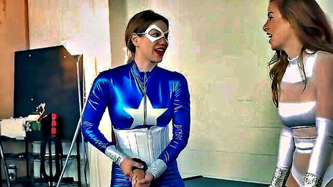 Mieko and Vanesa as superheroines in shiny latex costumes, BDSM tease