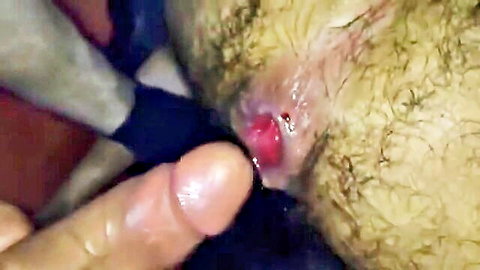 Close-up gay felch scene with hairy man fingering red anus