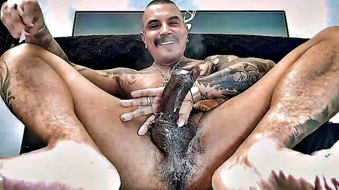 Tattooed muscular Latino man solo dildo play in gay porn video