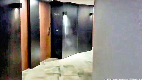 Empty hotel hallway with door 3701 ajar and light beam spilling out