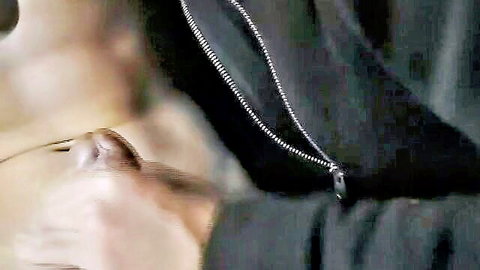 Close-up of handsome gay man in glasses and chain necklace, black shirt
