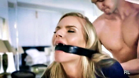 Blonde MILF gagged and restrained in intense BDSM domination scene