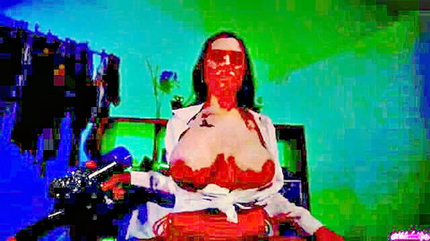 Busty webcam babe with huge tits covered in red paint posing with fake gun and sunglasses