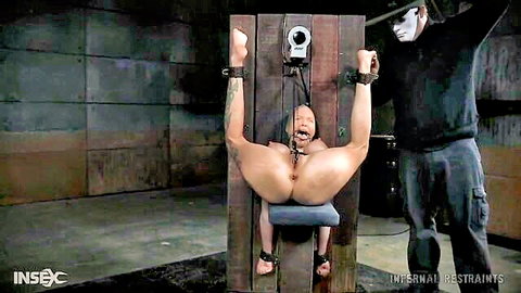 Rain Degrey bound nude and exposed in intense BDSM restraint