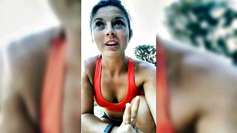 Hannah Barron in tight red sports bra outdoors, surprised open mouth