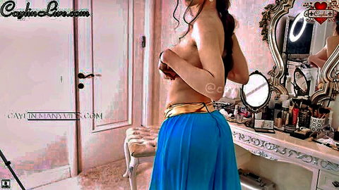Caylin as Jasmine topless in blue harem skirt, covering big tits