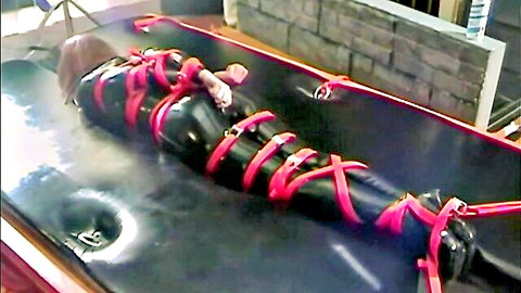 Bound redhead in latex, ballgagged and vibed in BDSM fetish scene