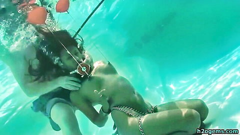 Drea topless in underwater BDSM pool scene with nipple pullers
