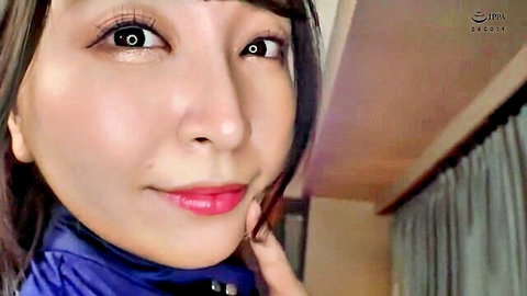Seductive Japanese woman in clothed JAV selfie, smiling with lewd expression