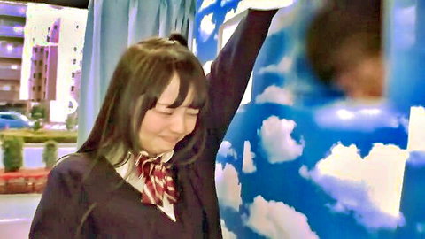 Cute Japanese schoolgirl in uniform smiling and waving arm on stage