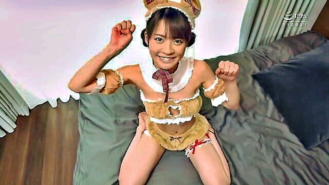 Cute Japanese girl in bear cosplay paws up teasing small tits cleavage on bed