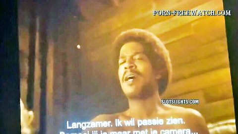 Vintage ebony man passionately singing in adult video scene