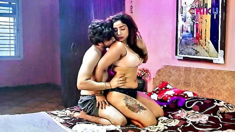 Hot Indian couple in pink bra and black panties embracing passionately