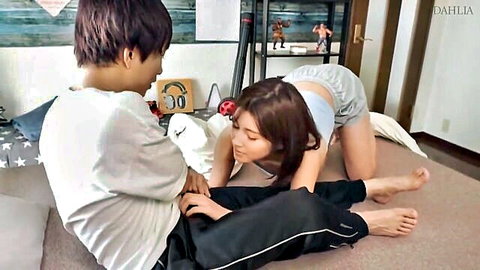 Skinny Japanese brunette in tight gray shorts on all fours as guy gropes her ass and pussy lips from behind