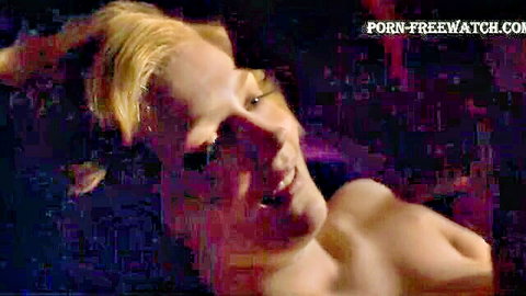 Blonde with medium tits throws head back smiling ecstatically, naked breasts exposed in passion.