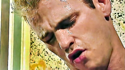Sweaty Paul Carrigan close-up in intense gay porn scene