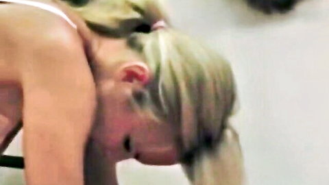 Blonde submissive bent over topless with sideboob exposed screaming in intense BDSM femdom whipping