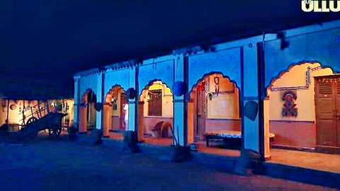 Illuminated Indian village arches and cart at night under ULLU banner, evoking steamy desi fantasies