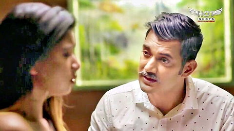Indian couple in intimate moment, cute girl with long hair faces mustached man
