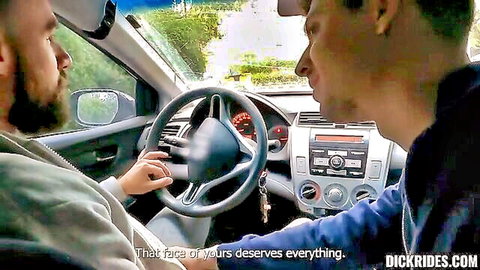 Bearded driver and Asian passenger in suggestive car stare-down