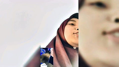 Smiling Indonesian hijab girl in maroon scarf, close-up tease