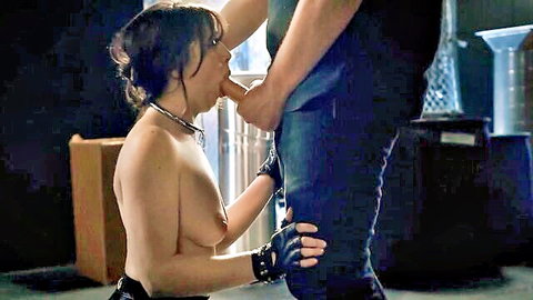 Brunette submissive kneels nude for intense BDSM blowjob