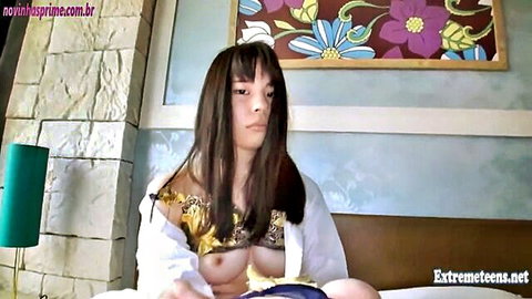 Japanese teen exposing small tits in open white shirt