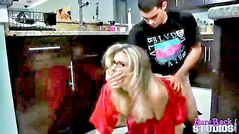 Blonde stepmom in red dress bent over by young guy in taboo kitchen scene