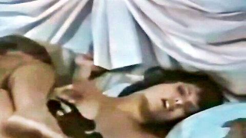 Vintage 80s woman in bed, hand between legs, teasing ass view